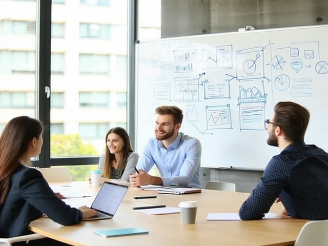 L&D facilitator at a whiteboard with a small group of employees in a bright conference room